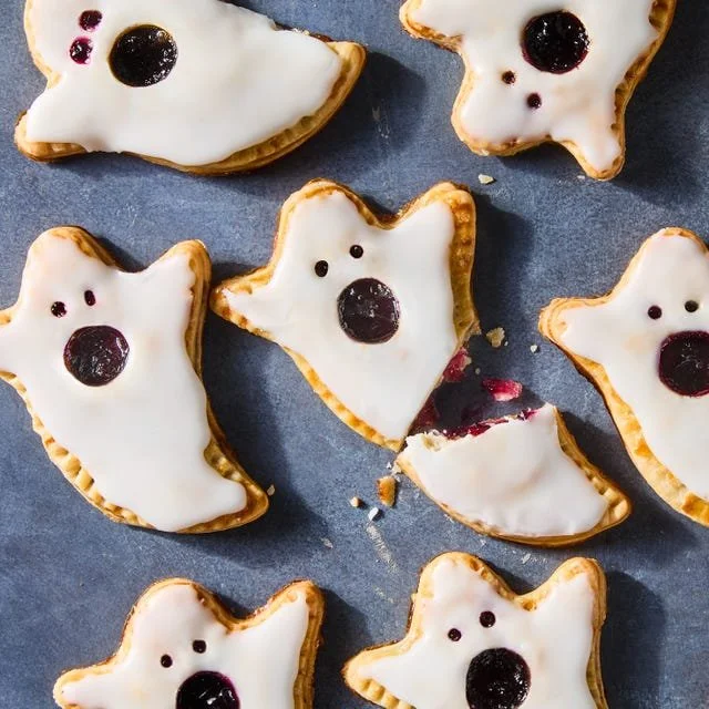 Delicious Boo-Berry Pies with vibrant blue filling and flaky crust