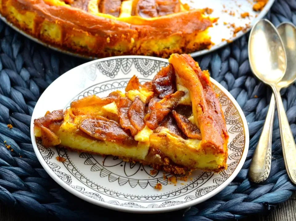 Caramel Swirl Apple Cheesecake topped with caramel and apple slices