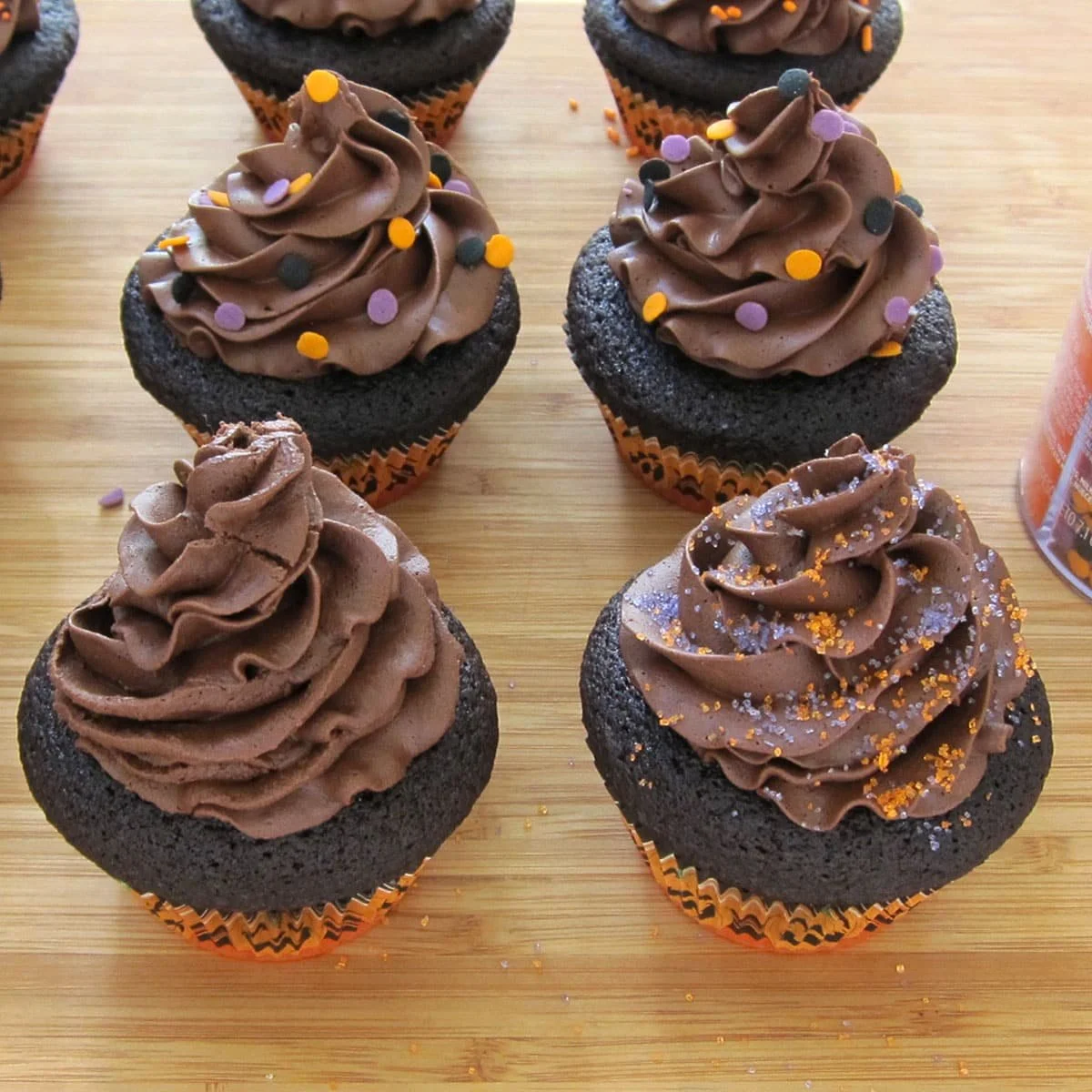 Cheesecake stuffed Halloween cupcakes decorated for festive treats.