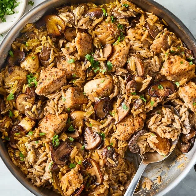 Plate of Chicken Marsala Orzo with tender chicken and mushrooms in Marsala sauce
