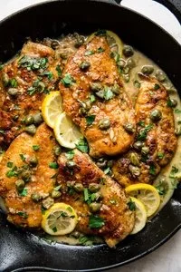 Delicious Chicken Piccata with lemon and capers on a plate