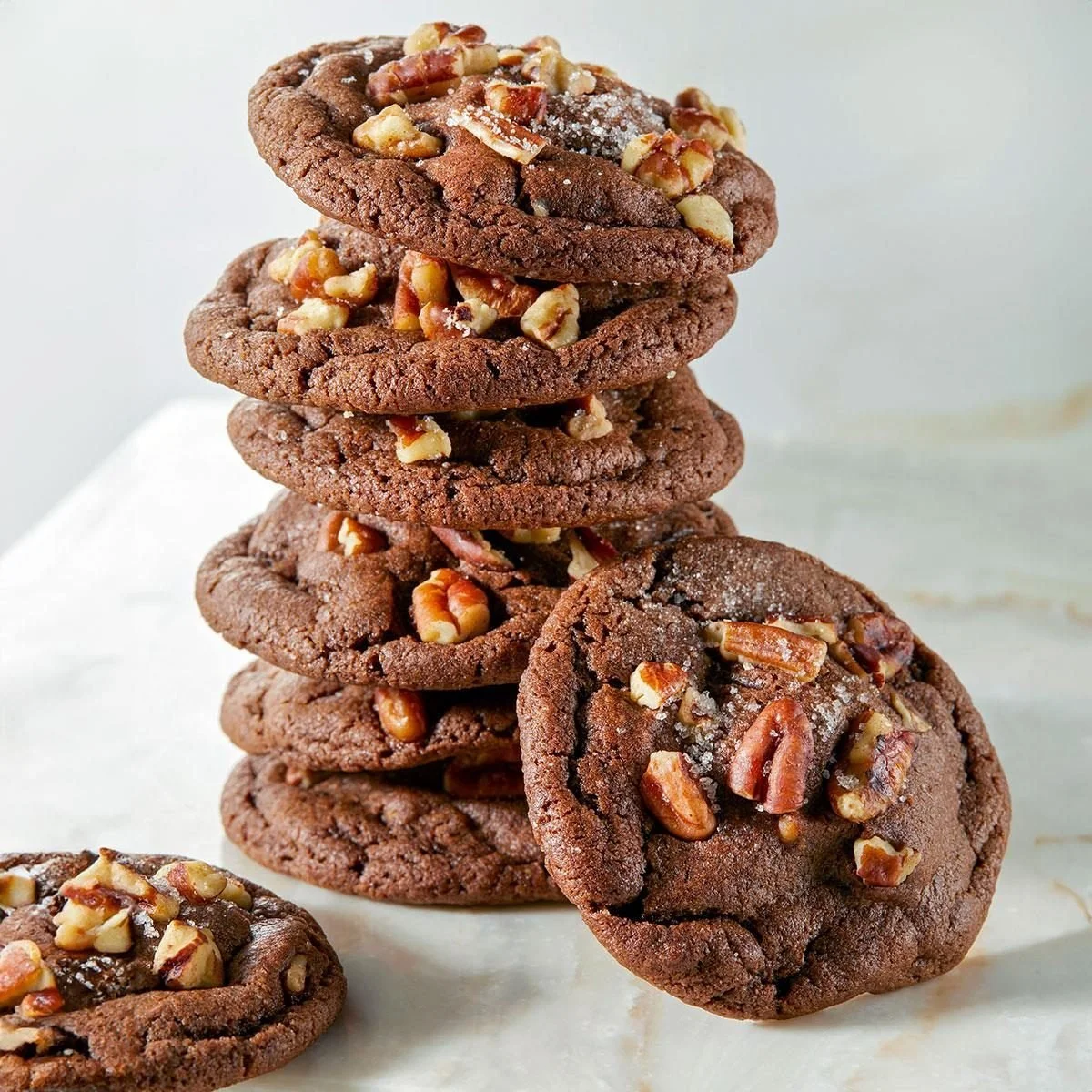 Freshly baked Chocolate Caramel Cookies with drizzled chocolate on top