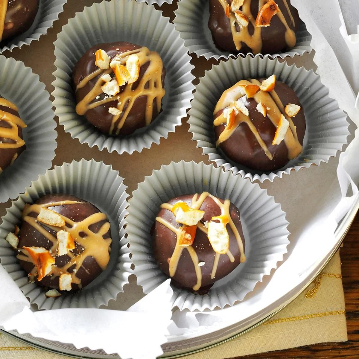 Chocolate covered peanut butter and pretzel truffles ready to be enjoyed