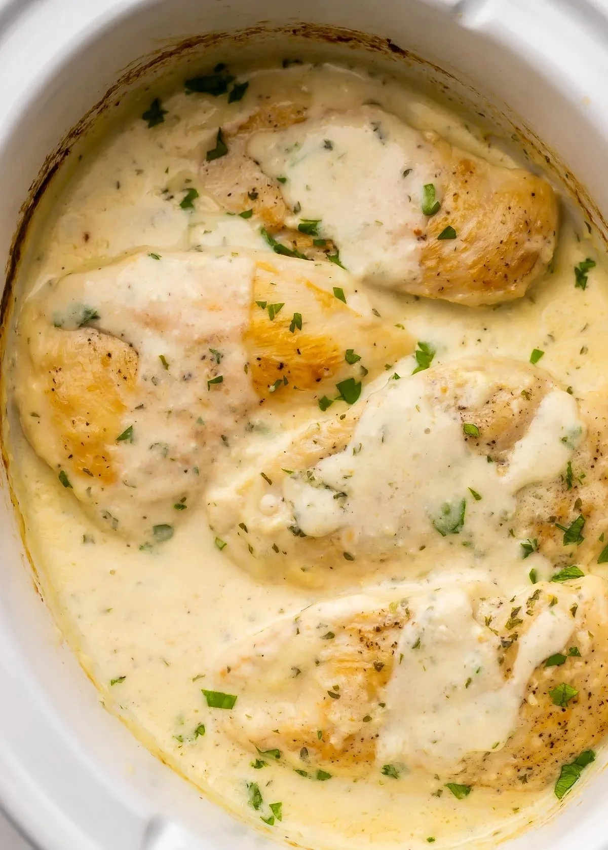 Crockpot Creamy Garlic Chicken served with a side of vegetables