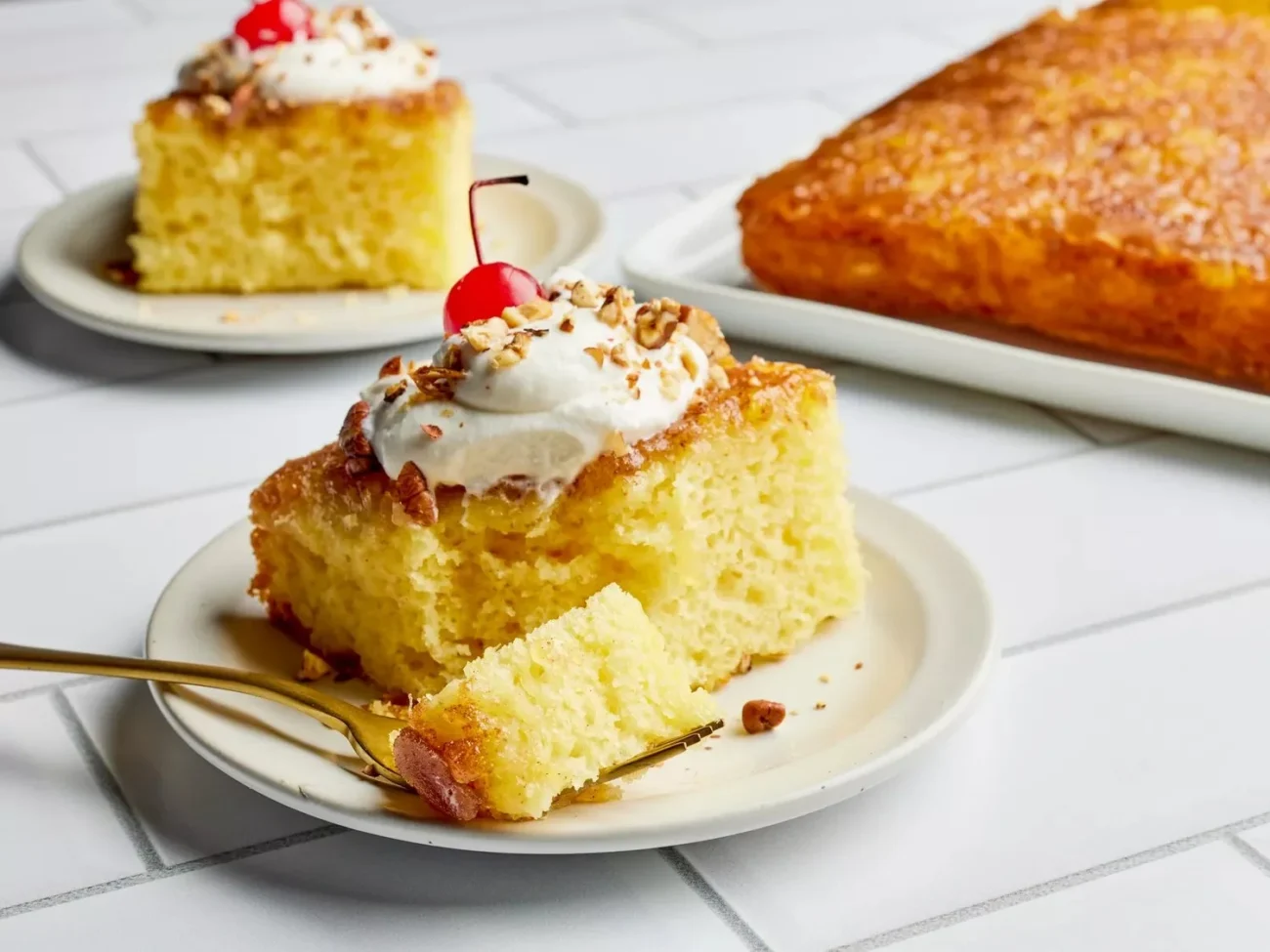 Deliciously moist Crushed Pineapple Upside Down Cake served on a plate.