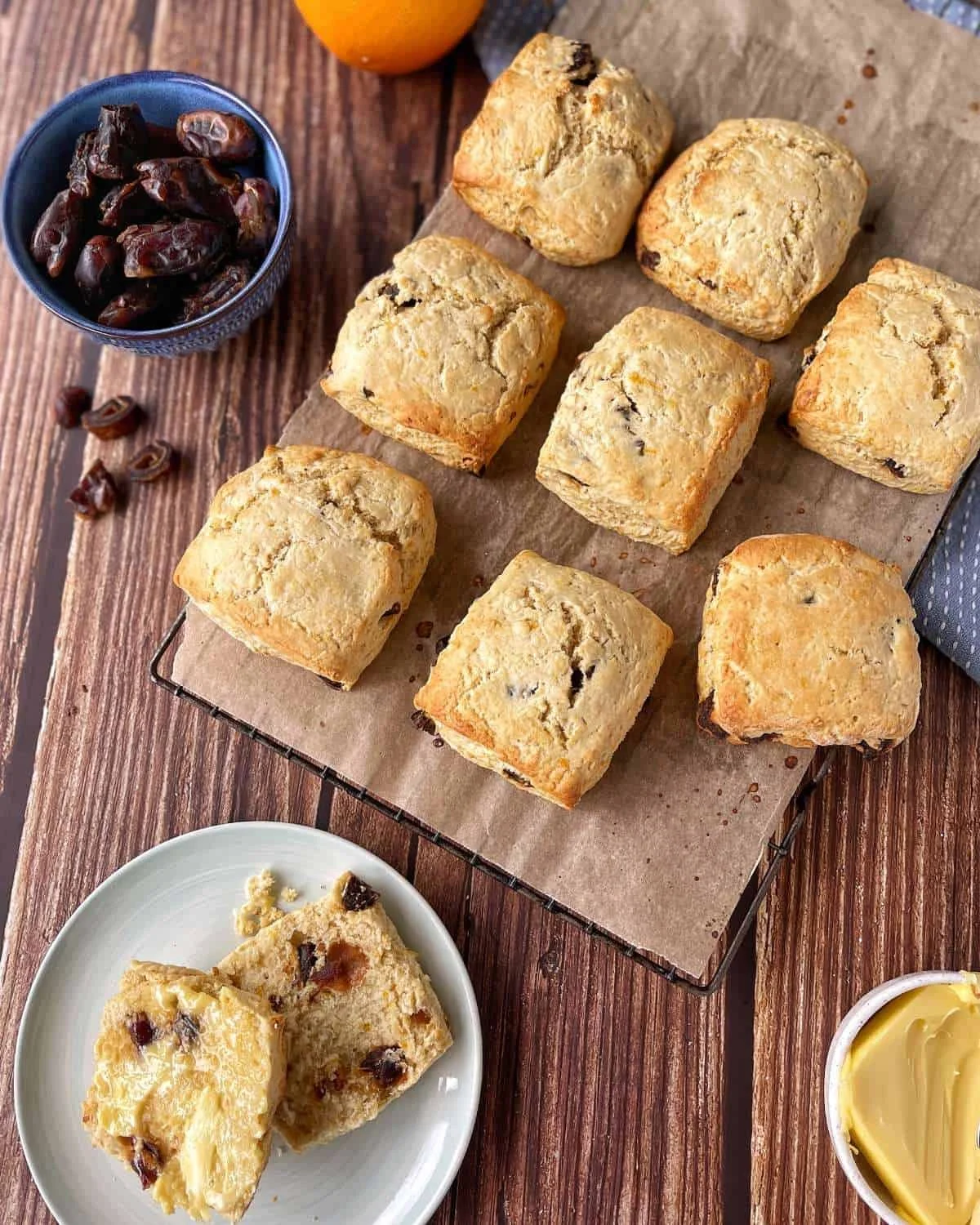 Freshly baked date and orange scones on a rustic wooden table