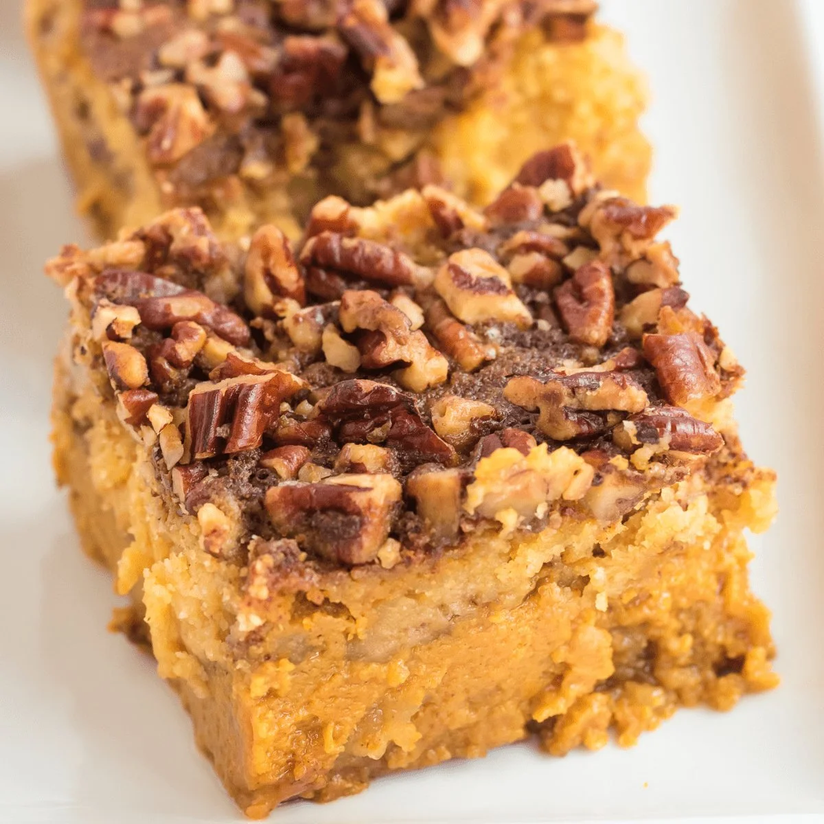 Delicious Dreamy Pumpkin Dump Cake served with whipped cream