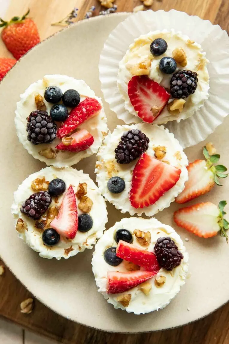 Frozen Yogurt Granola Cups with colorful toppings in a bowl