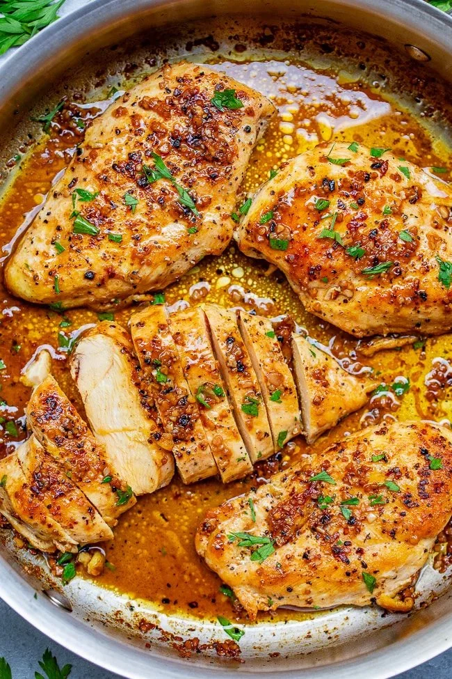 Delicious garlic butter chicken served with herbs on a plate