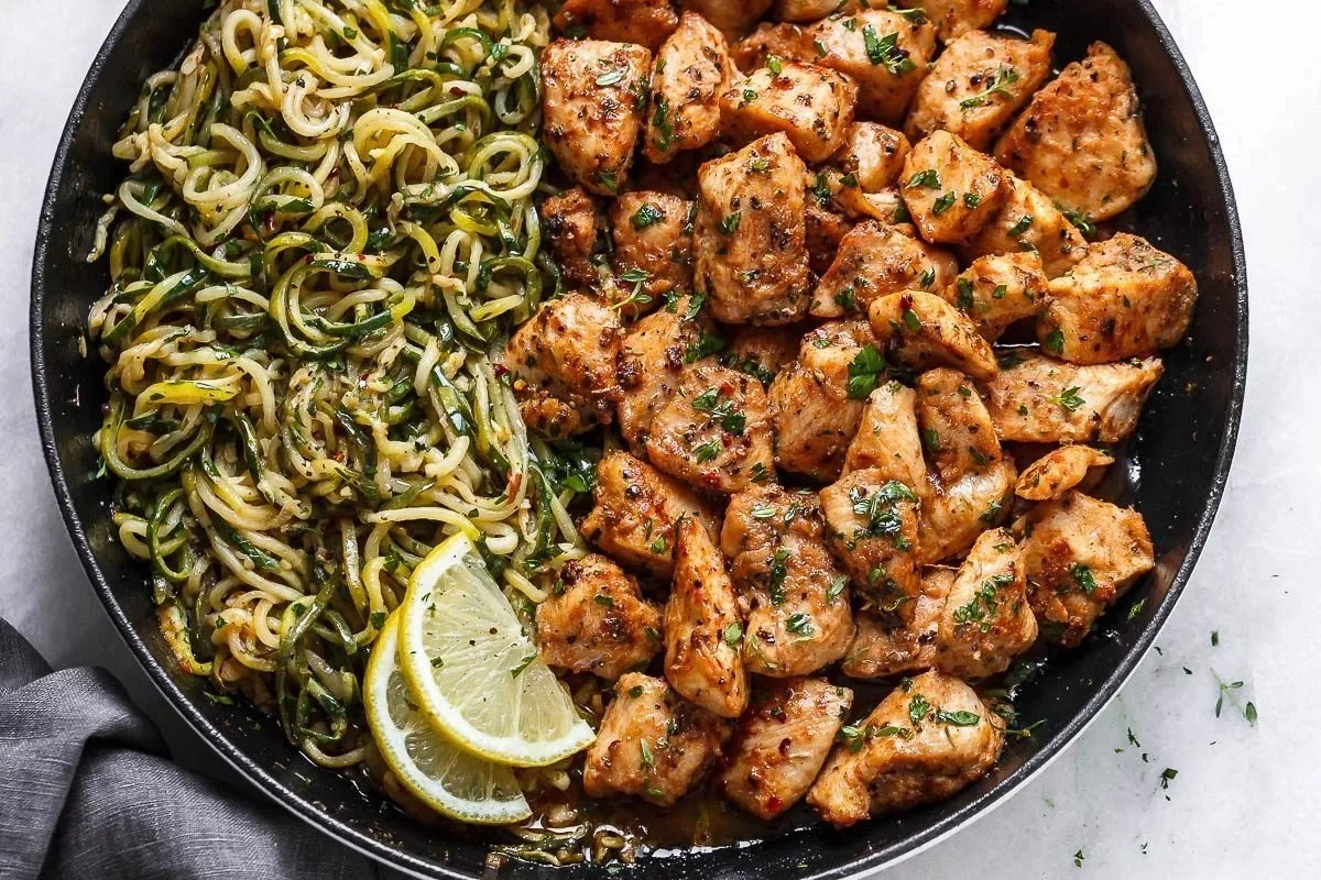 Delicious Garlic Butter Chicken Bites served with fresh Zucchini Noodles