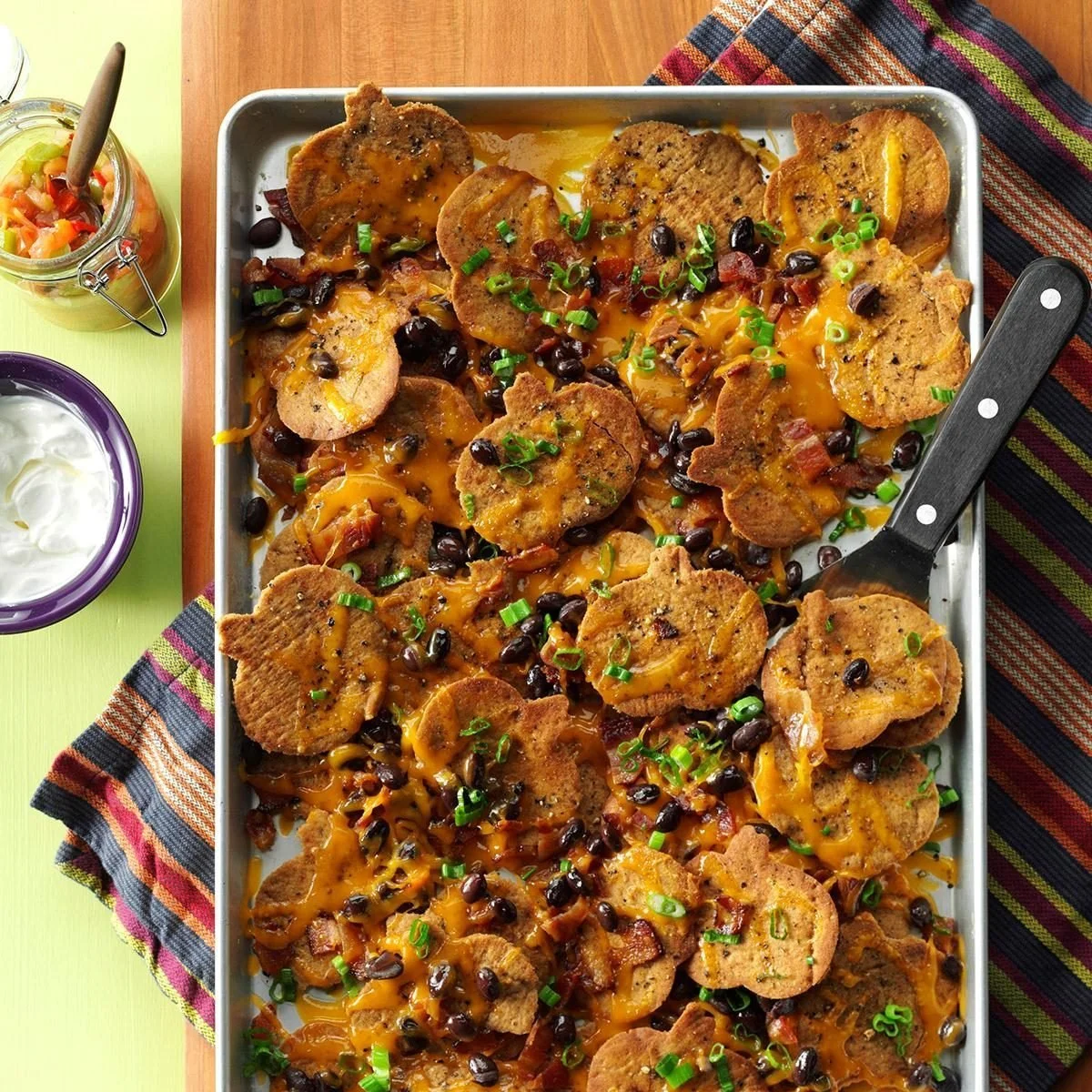 Creative Halloween nachos topped with festive pumpkin and spooky ingredients