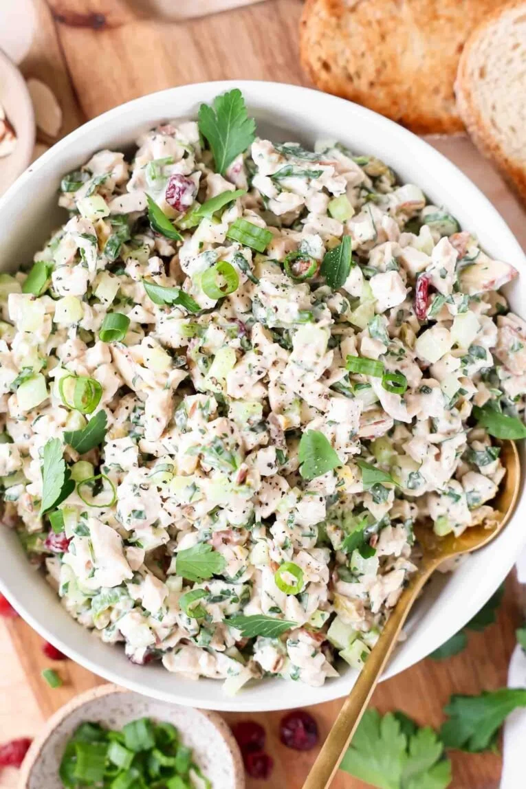 Healthy chicken salad with fresh ingredients and vibrant colors.