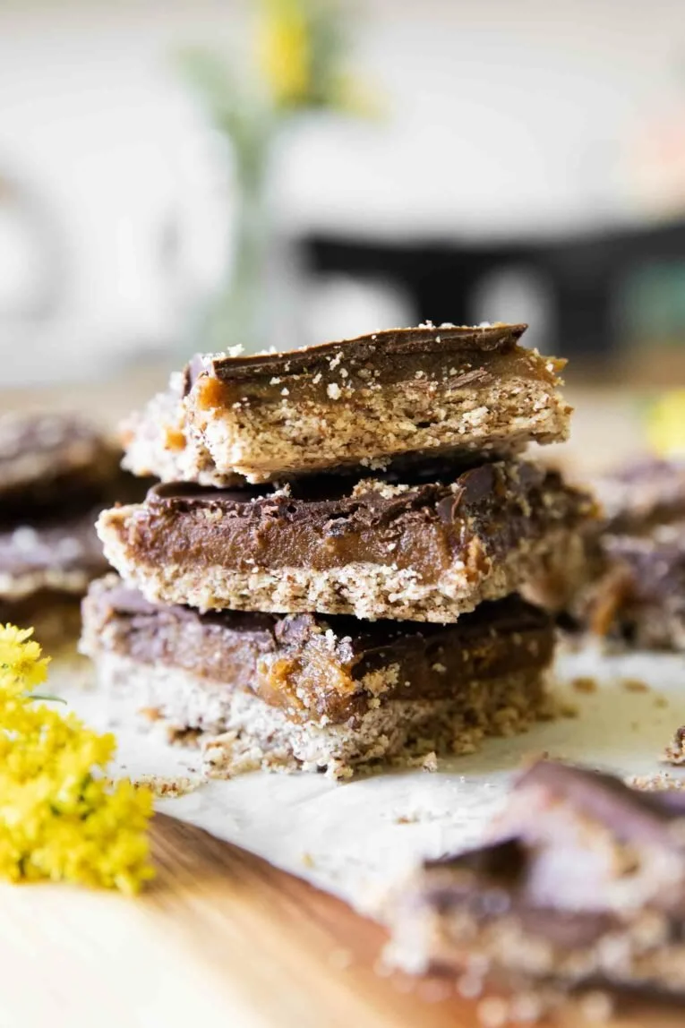 Homemade Date Twix Bars with a delicious chocolate coating and caramel layer