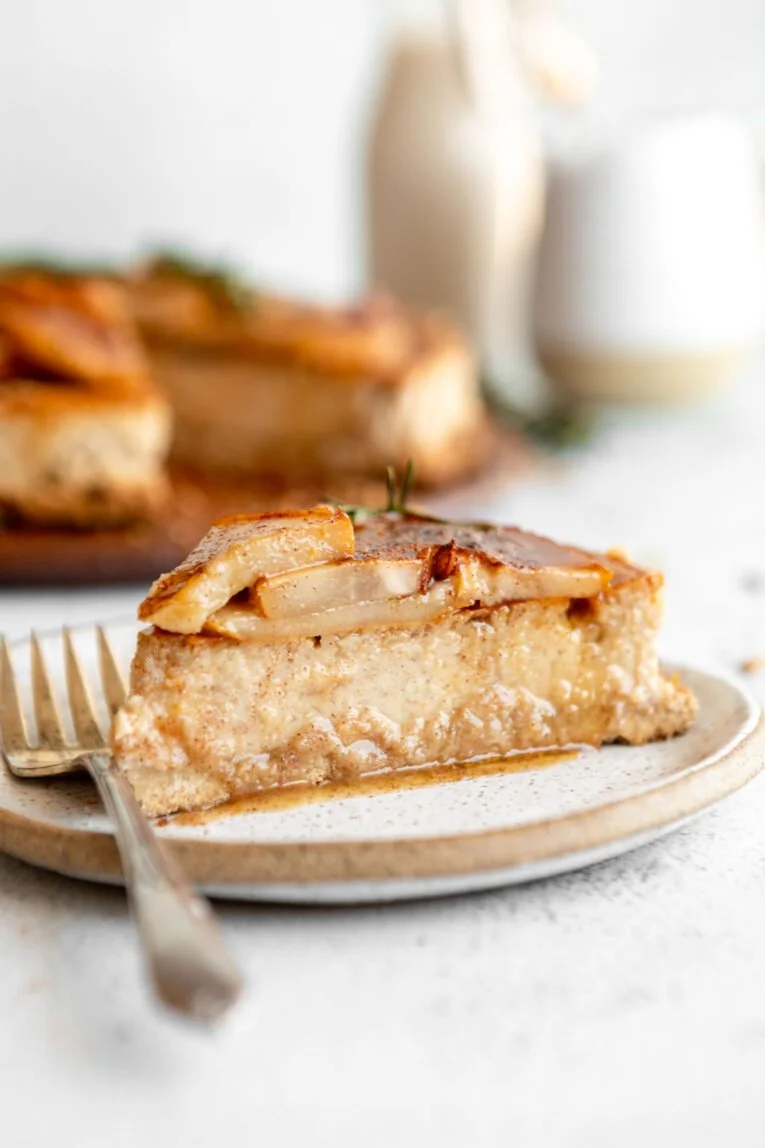 Delicious Honey Ginger Pear Cheesecake topped with fresh pears and ginger garnish.