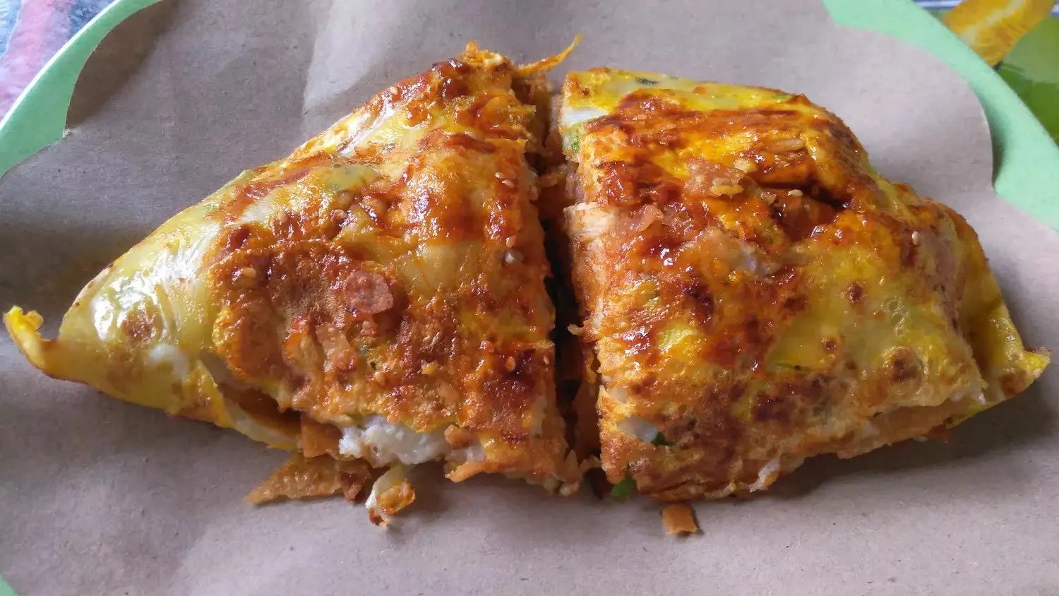 Delicious Jian Bing, a traditional Chinese crepe filled with fresh ingredients.