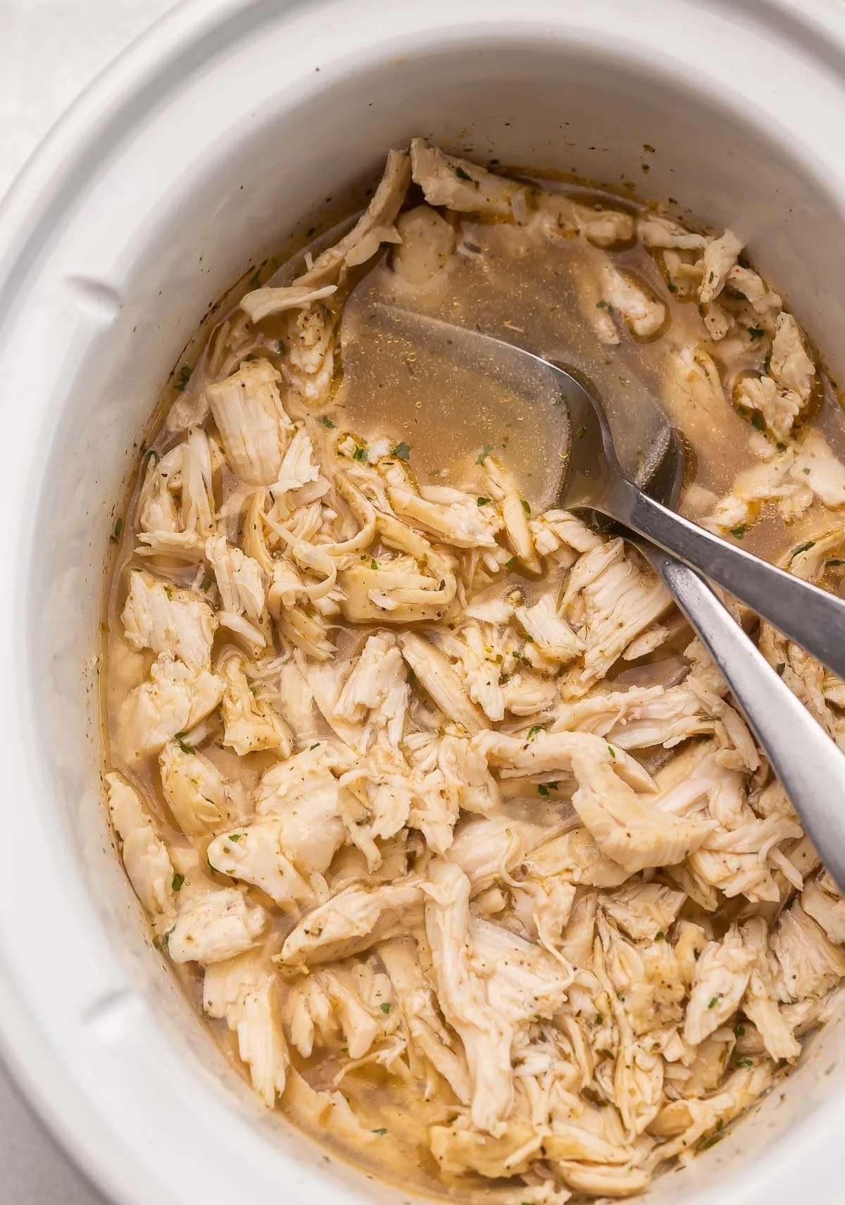 Deliciously juicy shredded chicken in a bowl ready for recipes