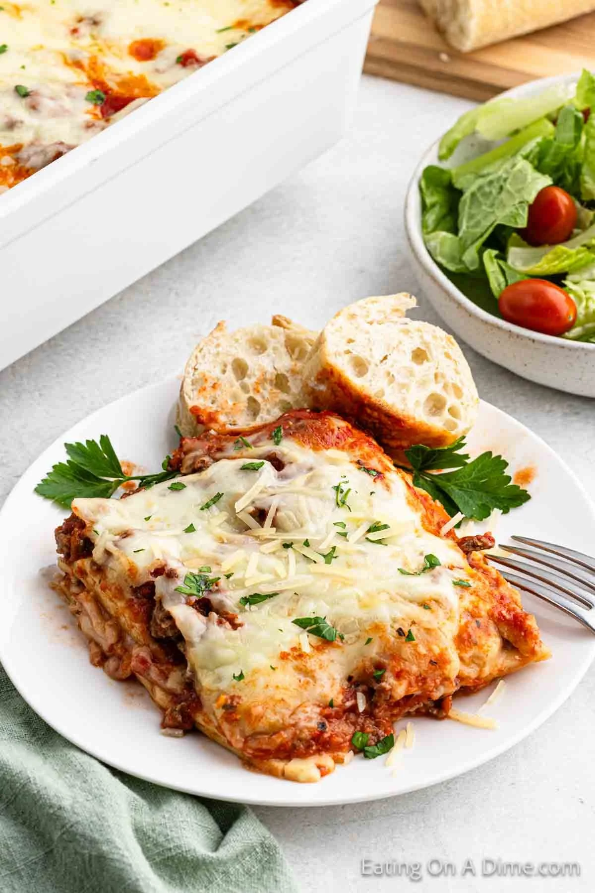 A delicious plate of Lazy Day Lasagna topped with cheese and herbs.