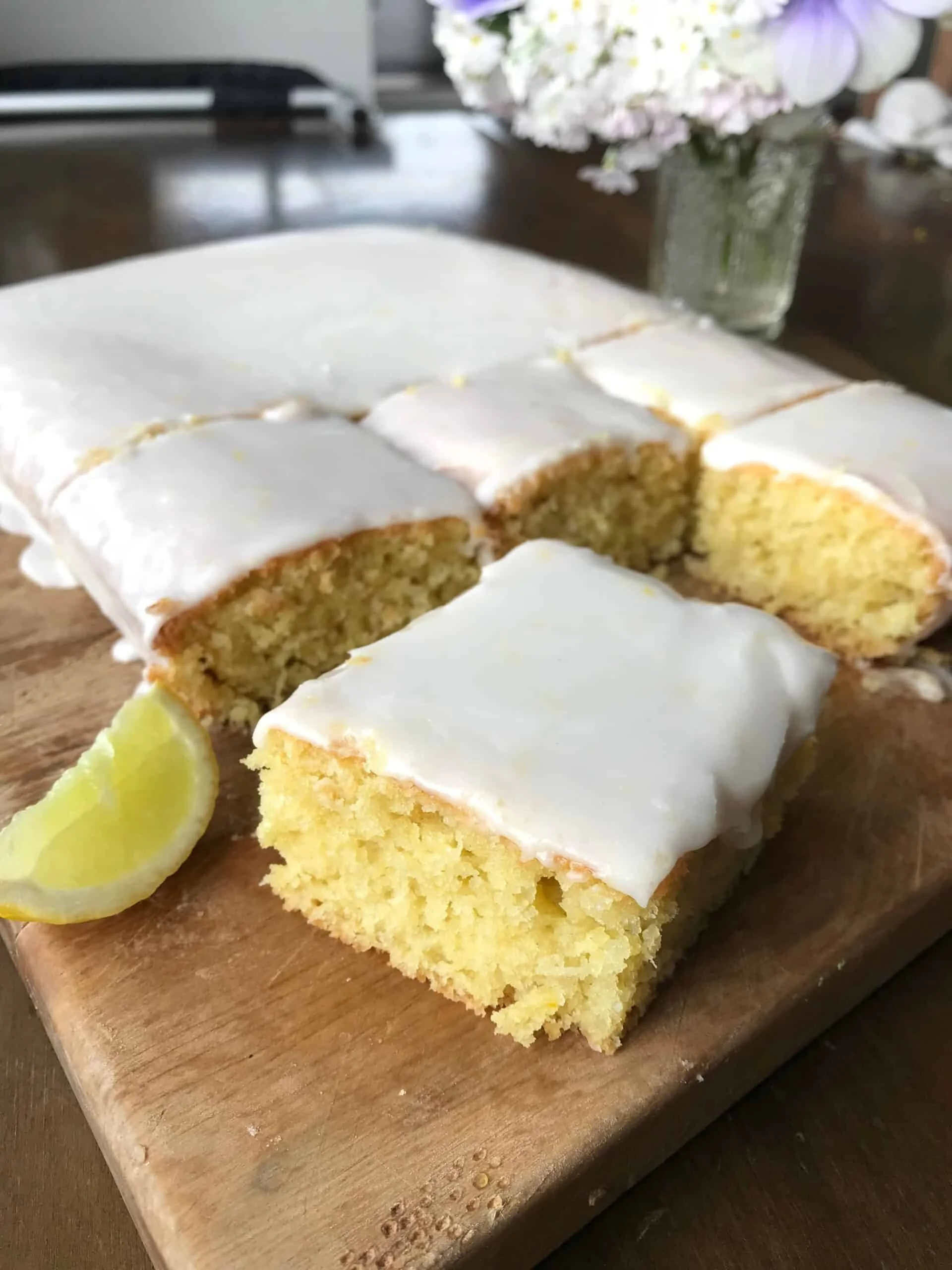 Lime Coconut Cake topped with fresh lime zest and coconut flakes