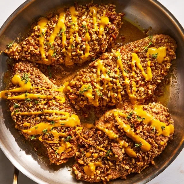 Maple Pecan Crusted Chicken served on a plate with garnish.