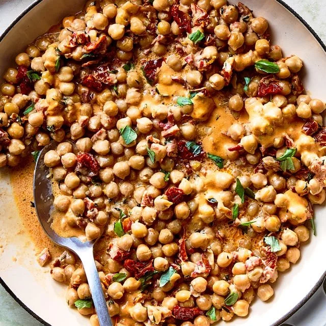 Delicious Marry Me Chickpeas served in a bowl with fresh herbs and spices