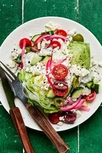 Mediterranean Wedge Salad with fresh toppings and vibrant colors