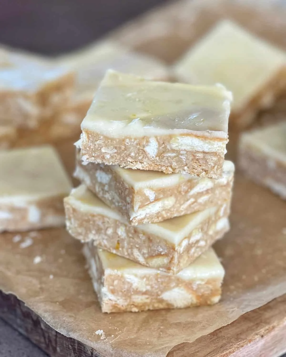 Delicious no-bake lemon slice dessert garnished with lemon zest.