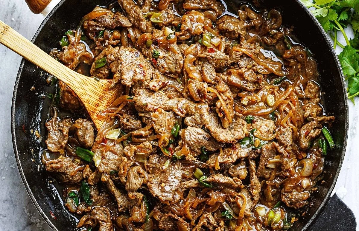 Delicious Onion Steak Stir Fry with vibrant vegetables cooked in a savory sauce.
