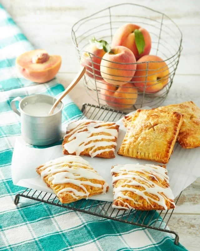 Freshly baked peach hand pies with golden crust and juicy peach filling
