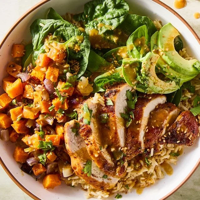 Peanut Chicken Protein Bowl with vegetables and garnishes
