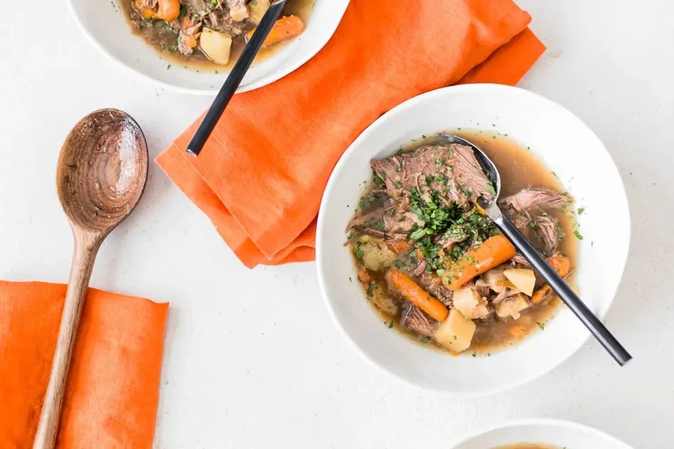 Deliciously cooked pot roast served with vegetables and gravy