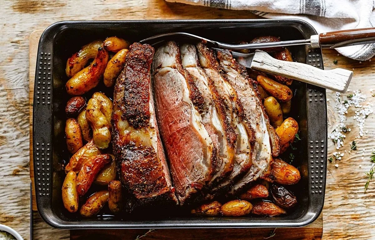 Perfect roast beef and potatoes with herb garlic butter served on a plate