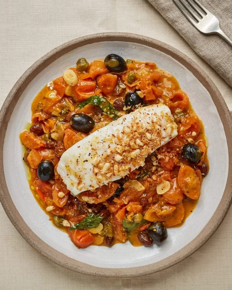 Delicious Pine Nut Cod served with flavorful Puttanesca Sauce