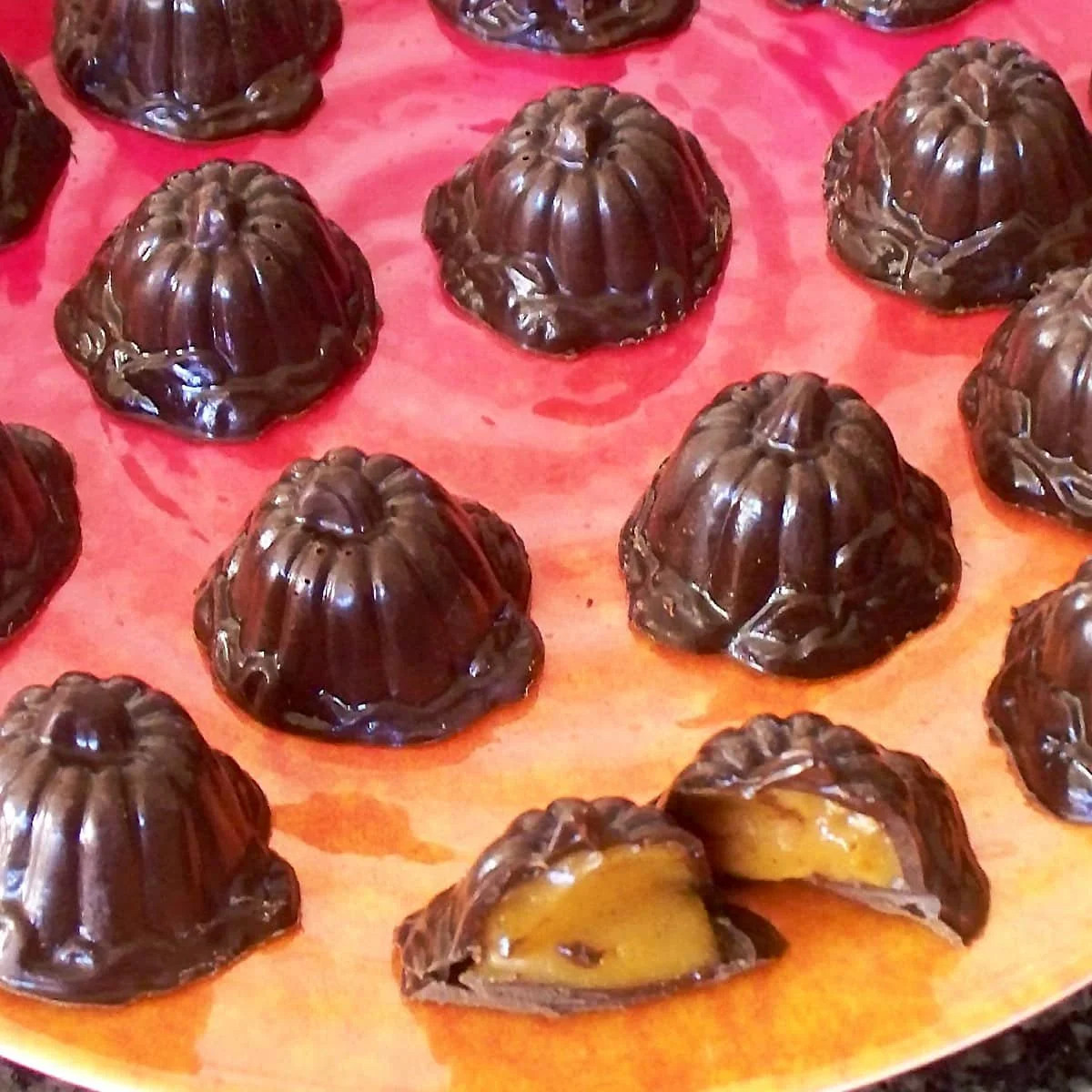 Delicious pumpkin truffles coated in chocolate with a seasonal touch.