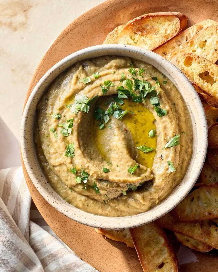 Delicious roasted eggplant dip served with pita and veggies