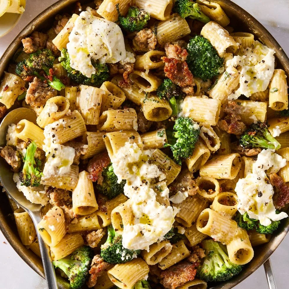 Sausage and Broccoli Burrata Pasta garnished with fresh herbs