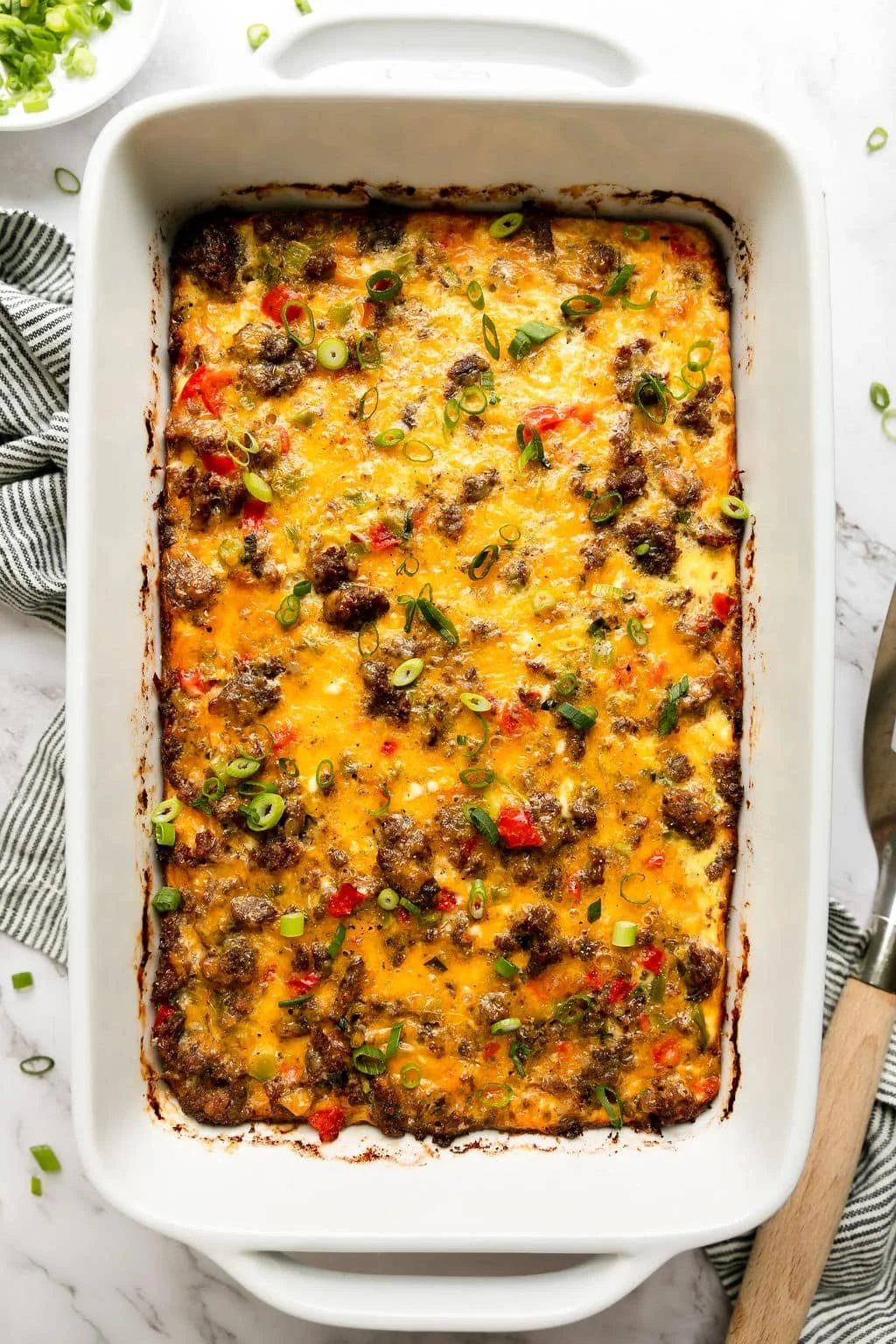 Sausage Egg Bake fresh out of the oven, garnished and ready to serve.