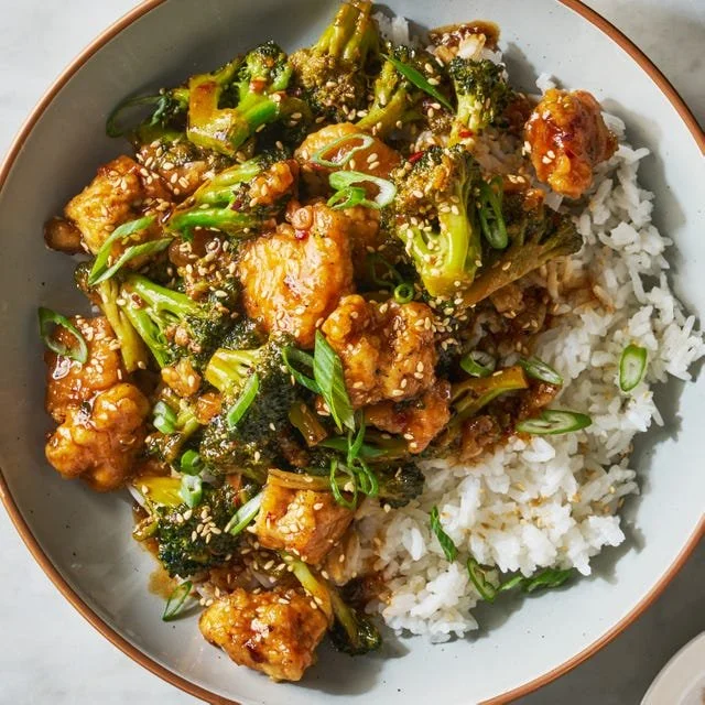 Stir-fried sesame tofu and broccoli in a vibrant dish