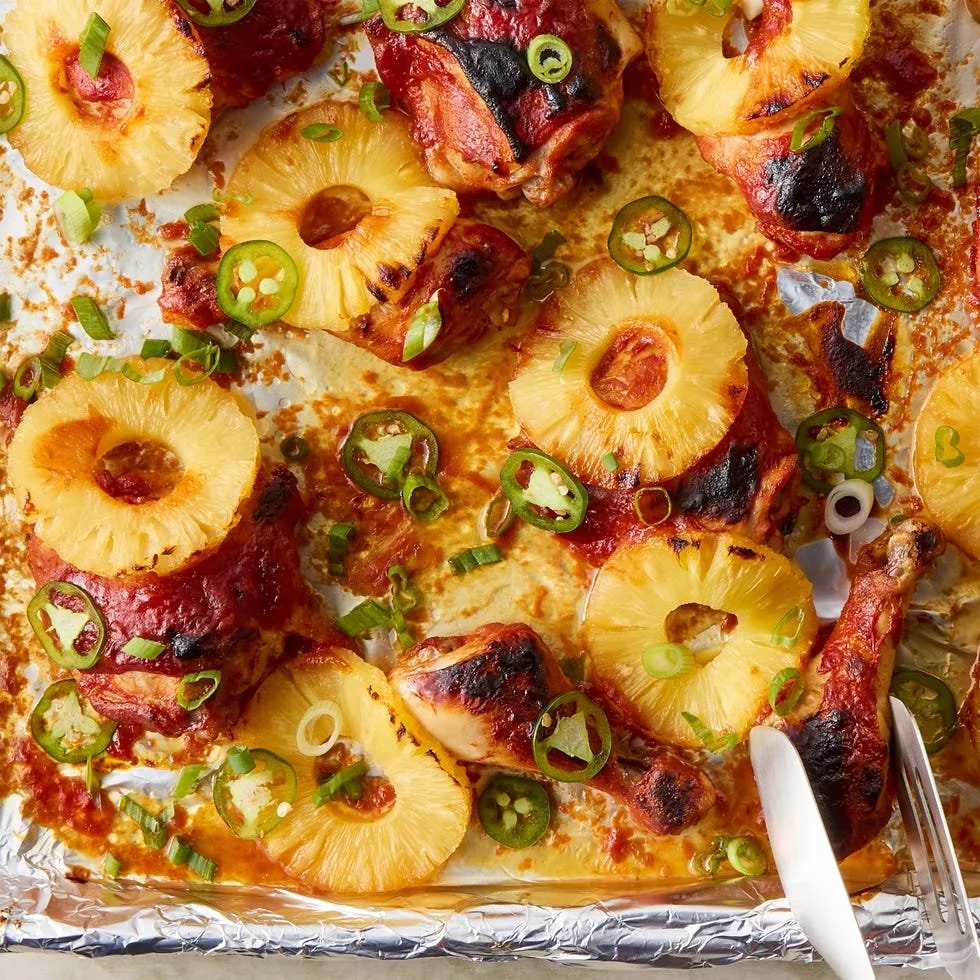 Sheet-Pan BBQ Pineapple Chicken with vibrant fruits and juicy chicken on a plate