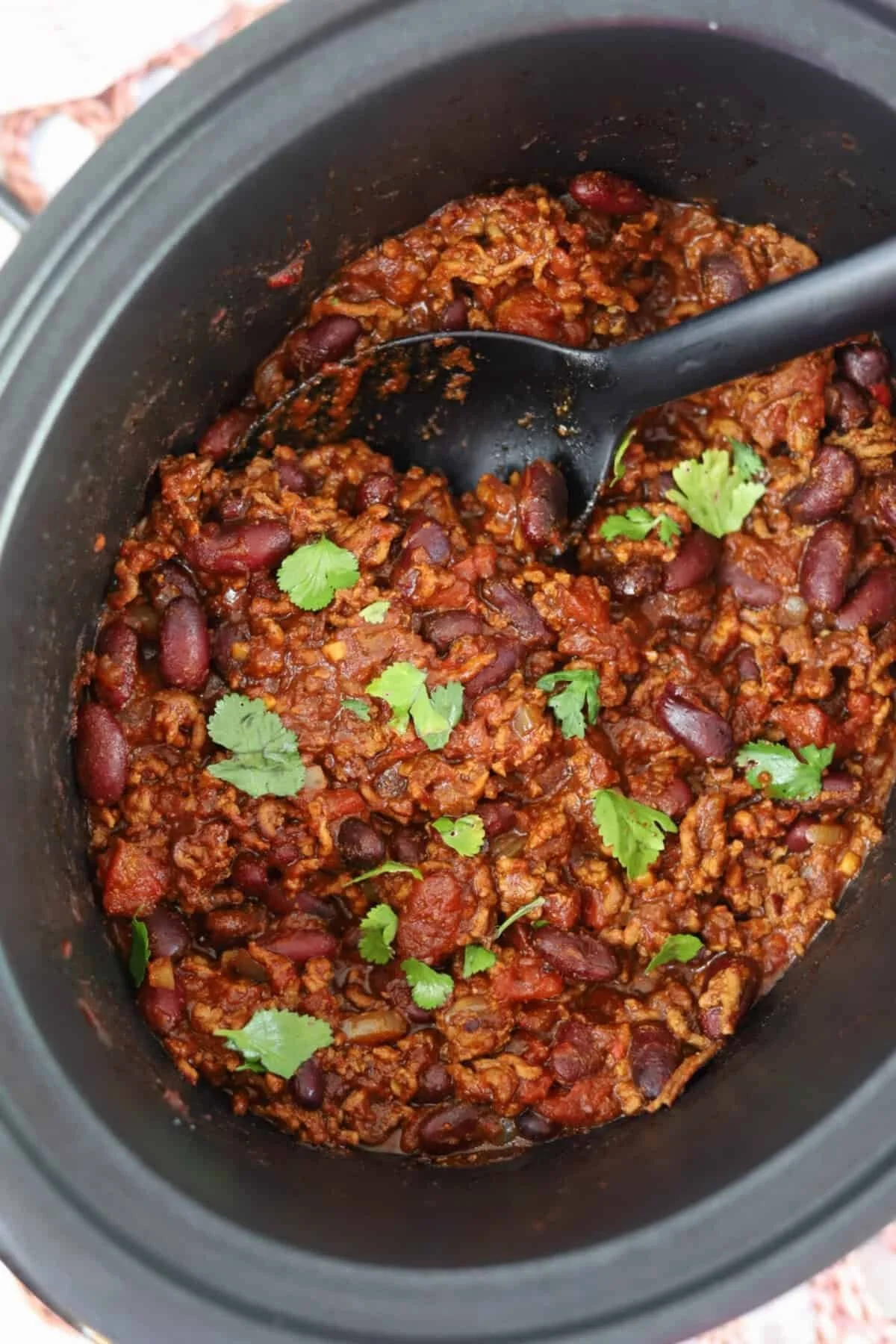 Delicious slow cooker chili with meat served in a bowl