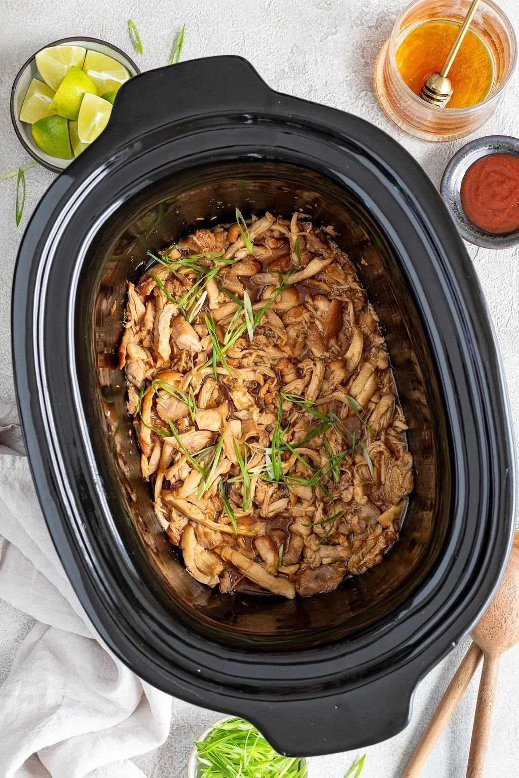 Slow Cooker Honey Garlic Chicken served on a plate with vegetables.
