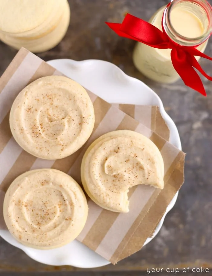 Soft eggnog sugar cookies decorated with festive sprinkles on a plate