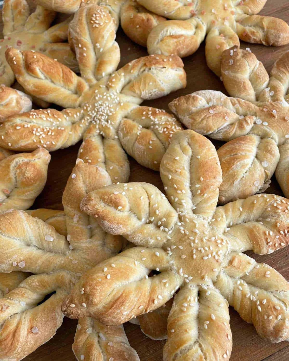 Homemade star bread baked and presented beautifully on a wooden table.