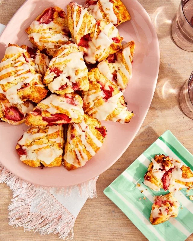 Delicious strawberry scones with Amaretto glaze on a white plate