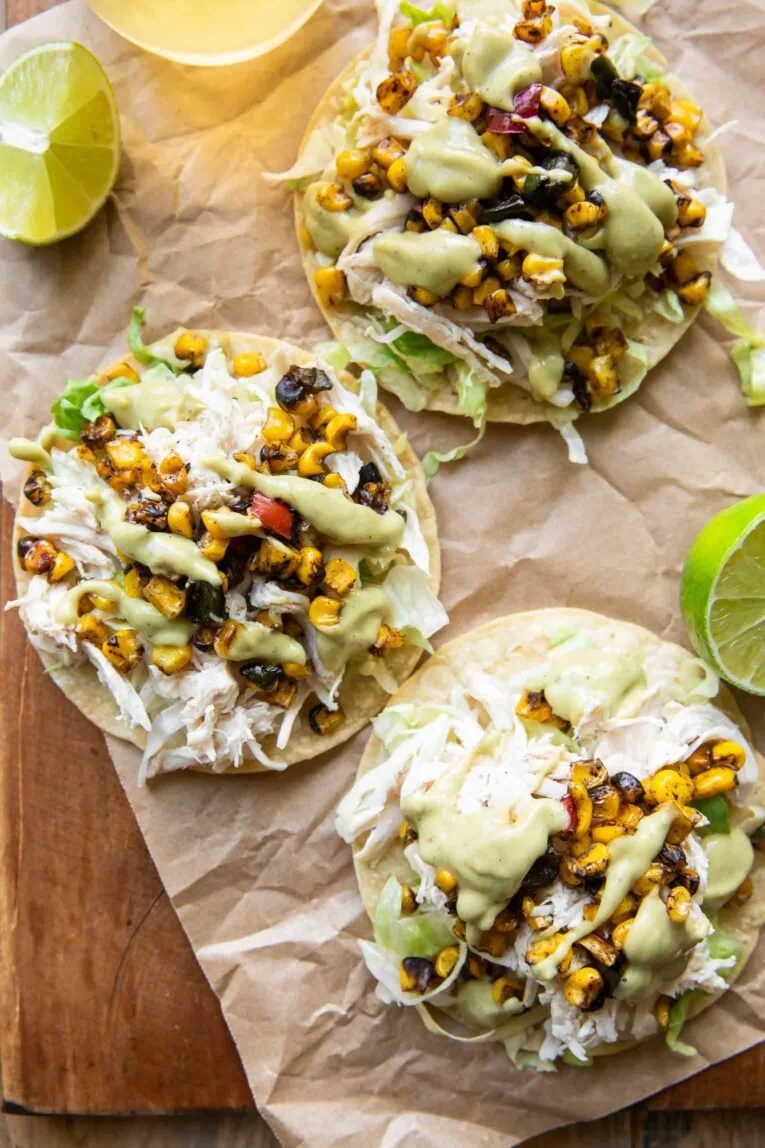 Tasty street corn chicken tostadas topped with fresh ingredients