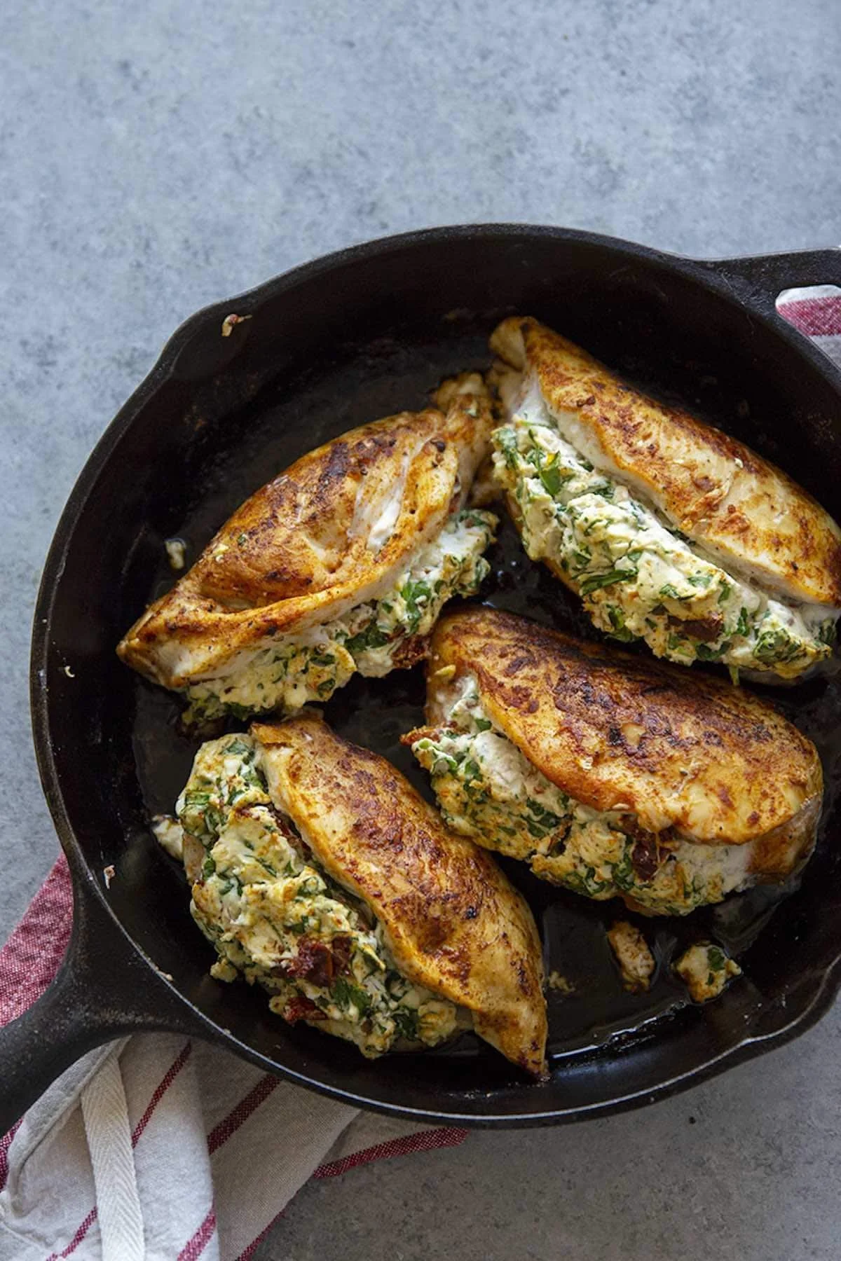 Savory stuffed chicken breast with herbs and spices on a plate