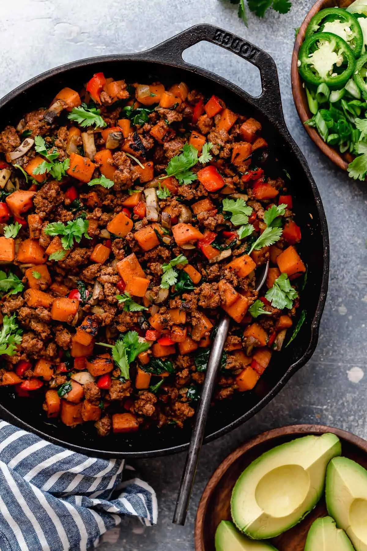 Delicious Tex-Mex Sweet Potato Hash served in a skillet with toppings