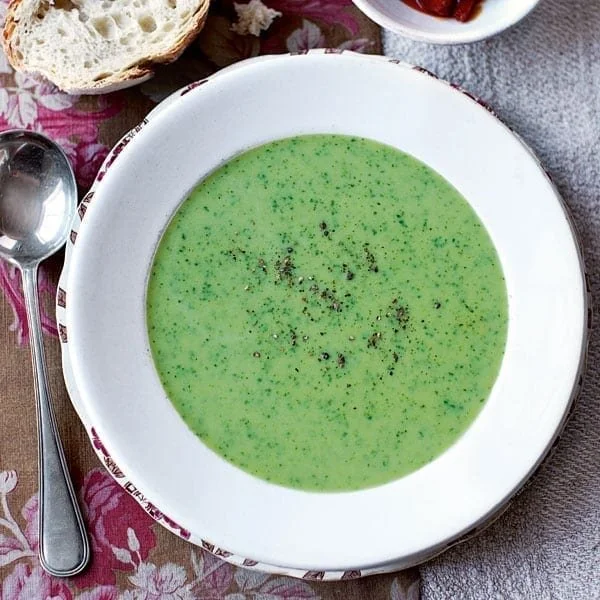 Bowl of healthy Watercress and Parsley Soup garnished with fresh herbs