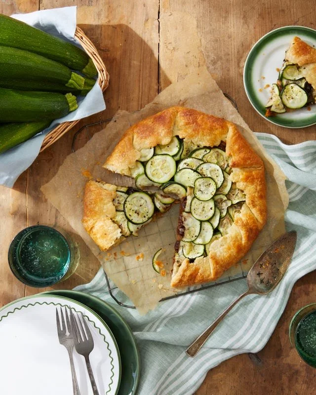 Freshly baked zucchini galette with crispy crust and vibrant zucchini slices