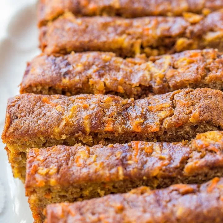 Loaf of freshly baked Apple Carrot Bread with visible chunks of apple and carrots.