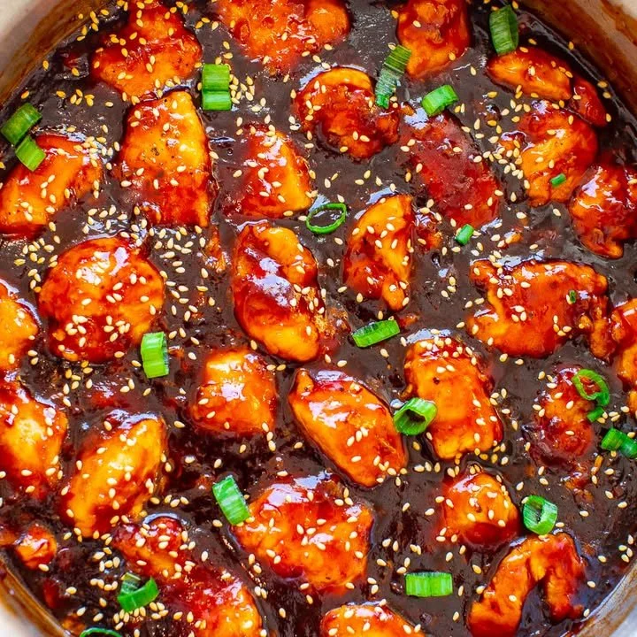 Plate of better-than-takeout sticky chicken served with rice and vegetables